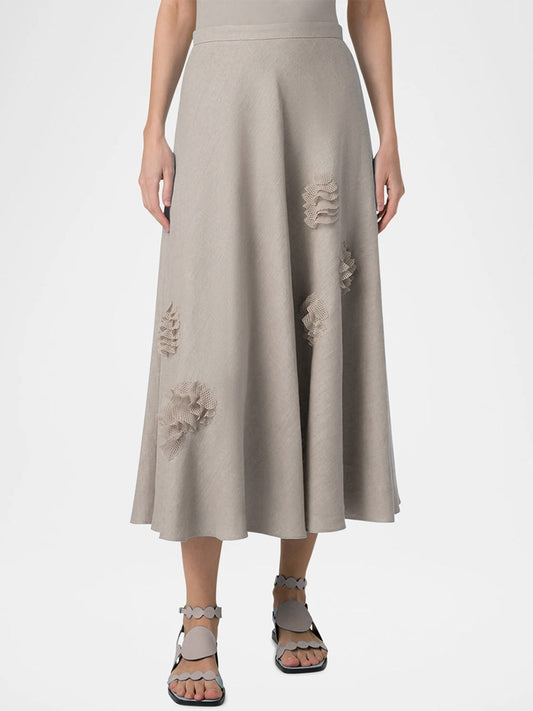 A person wearing the Akris Punto Raw Linen 3D Carnation Midi Skirt in Chalk and sandals, shown from shoulders down against a plain background.