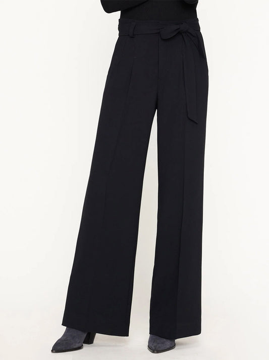 Black high-waisted, wide leg Brochu Walker Duke Pant with a tie belt, worn by a model cropped at the waist, showing only the lower body.