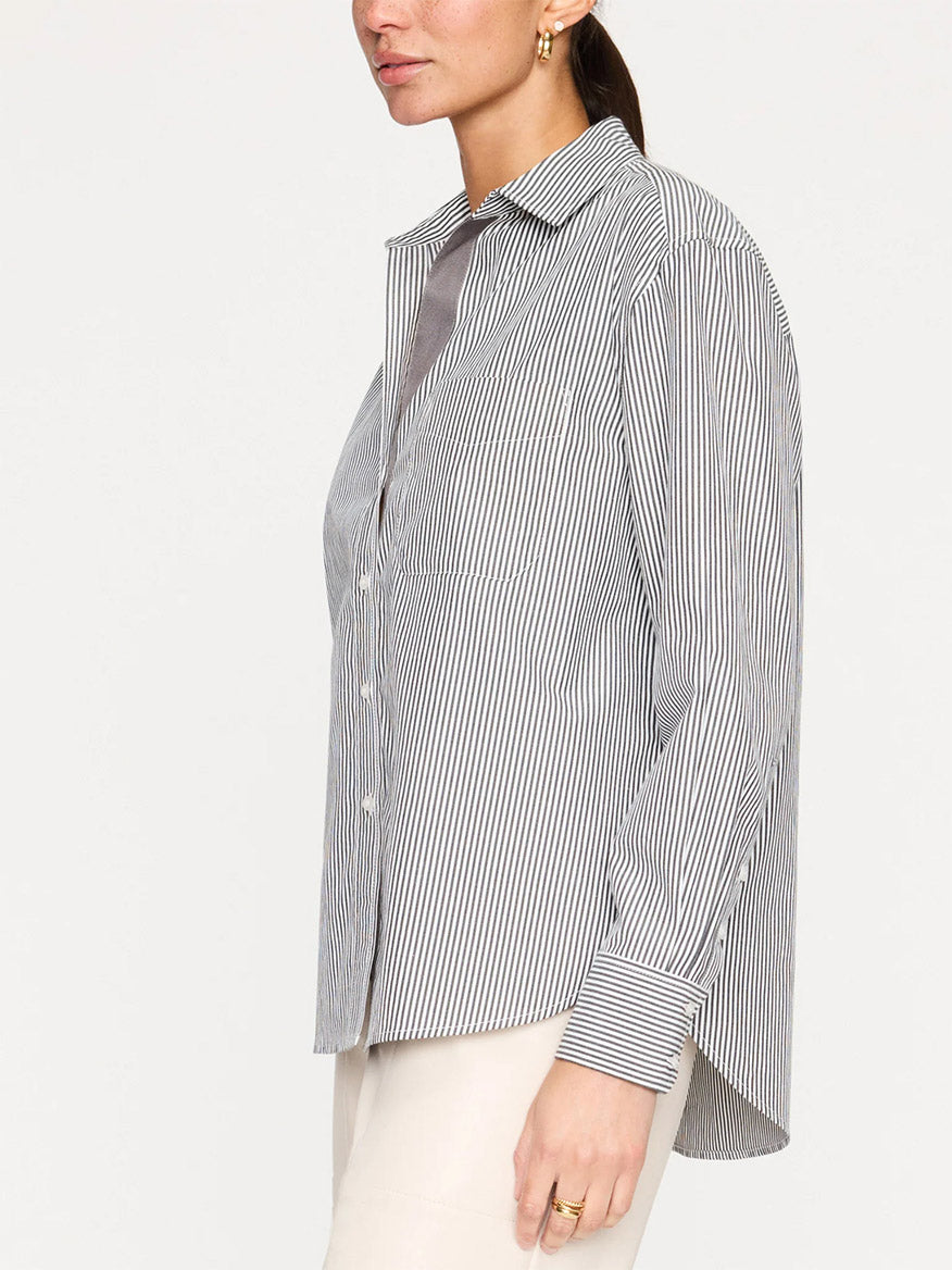 Woman wearing a Brochu Walker Everyday Shirt in Grey Stripe, viewed from the side.