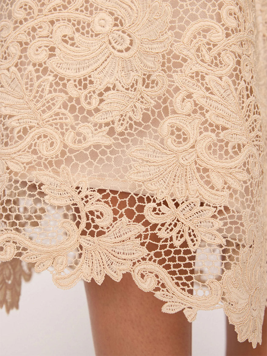 Detailed floral lace fabric with a scalloped hem on the Brochu Walker Mara Lace Skirt in Buff.