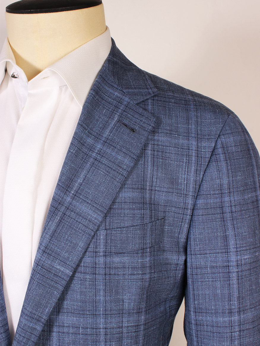Close-up of a person wearing the Canali Flap Pocket Sport Jacket in Blue Plaid over a white dress shirt, shown from shoulders to mid-torso.