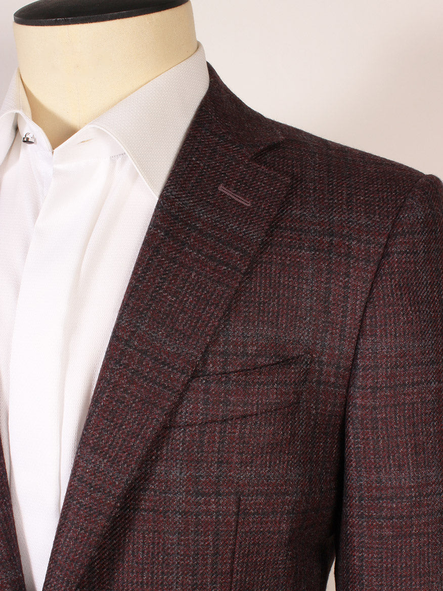 A close-up of a mannequin wearing a crisp white dress shirt and the Canali Flap Pocket Sport Jacket in Burgundy Plaid, made in Italy.