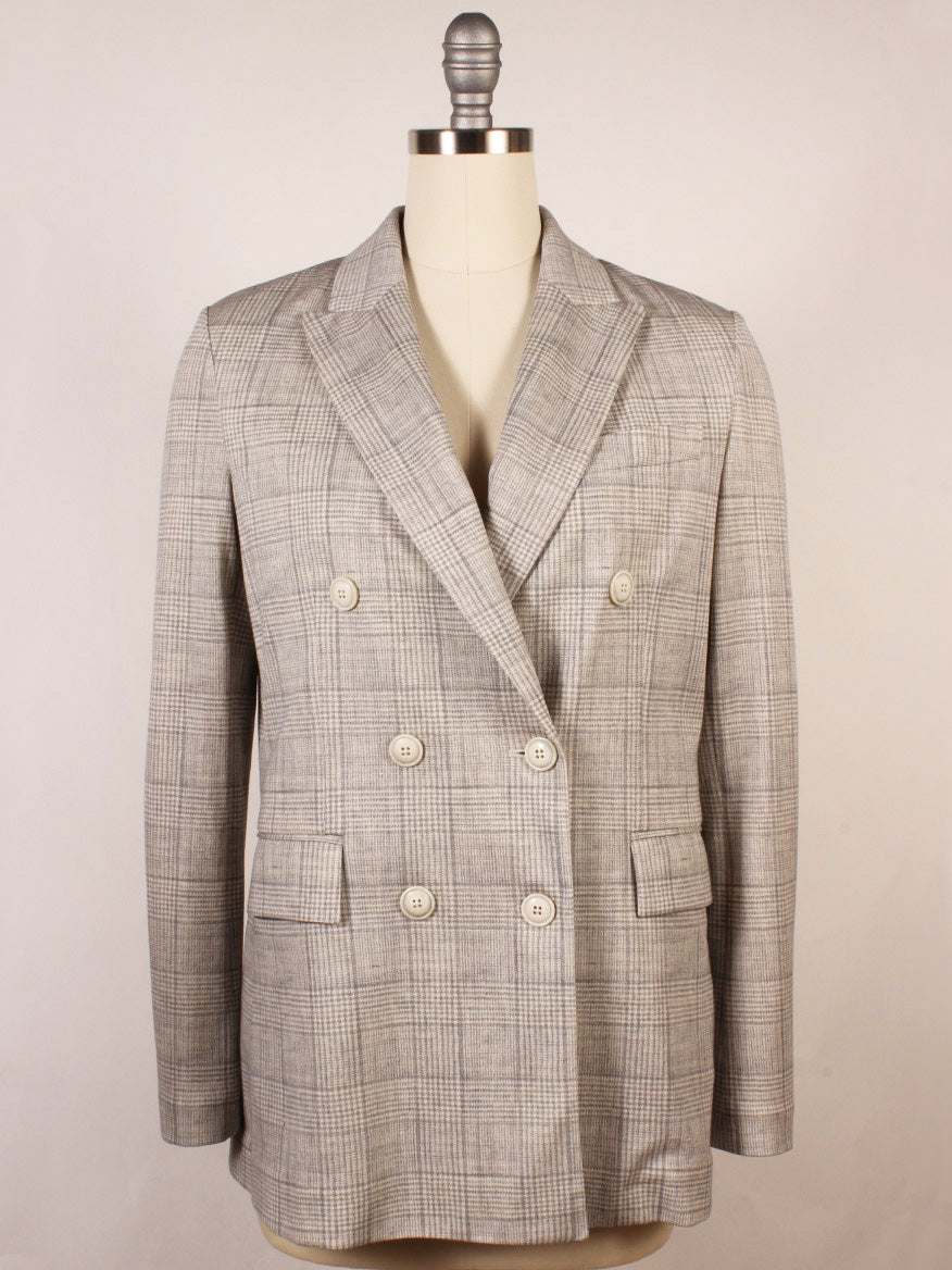 The Circolo 1901 Prince of Wales Double-Breasted Jacket in Grey, featuring peak lapels and front flap pockets, is displayed on a dress form against a plain background.