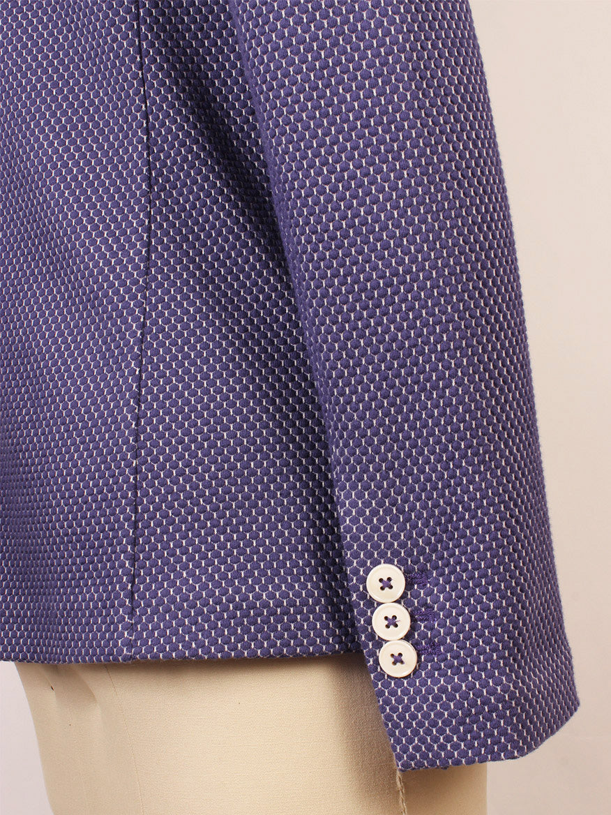 A close-up side view of the Circolo 1901 2-Button Slim Honeycomb Jacket in Space Cobalt, purple with three white buttons near the cuff and notch lapels, displayed on a mannequin.