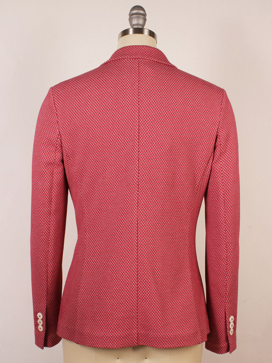 The Circolo 1901 2-Button Slim Honeycomb Jacket in Magenta, shown from the back on a mannequin, features long sleeves, white cuff buttons, and notch lapels.