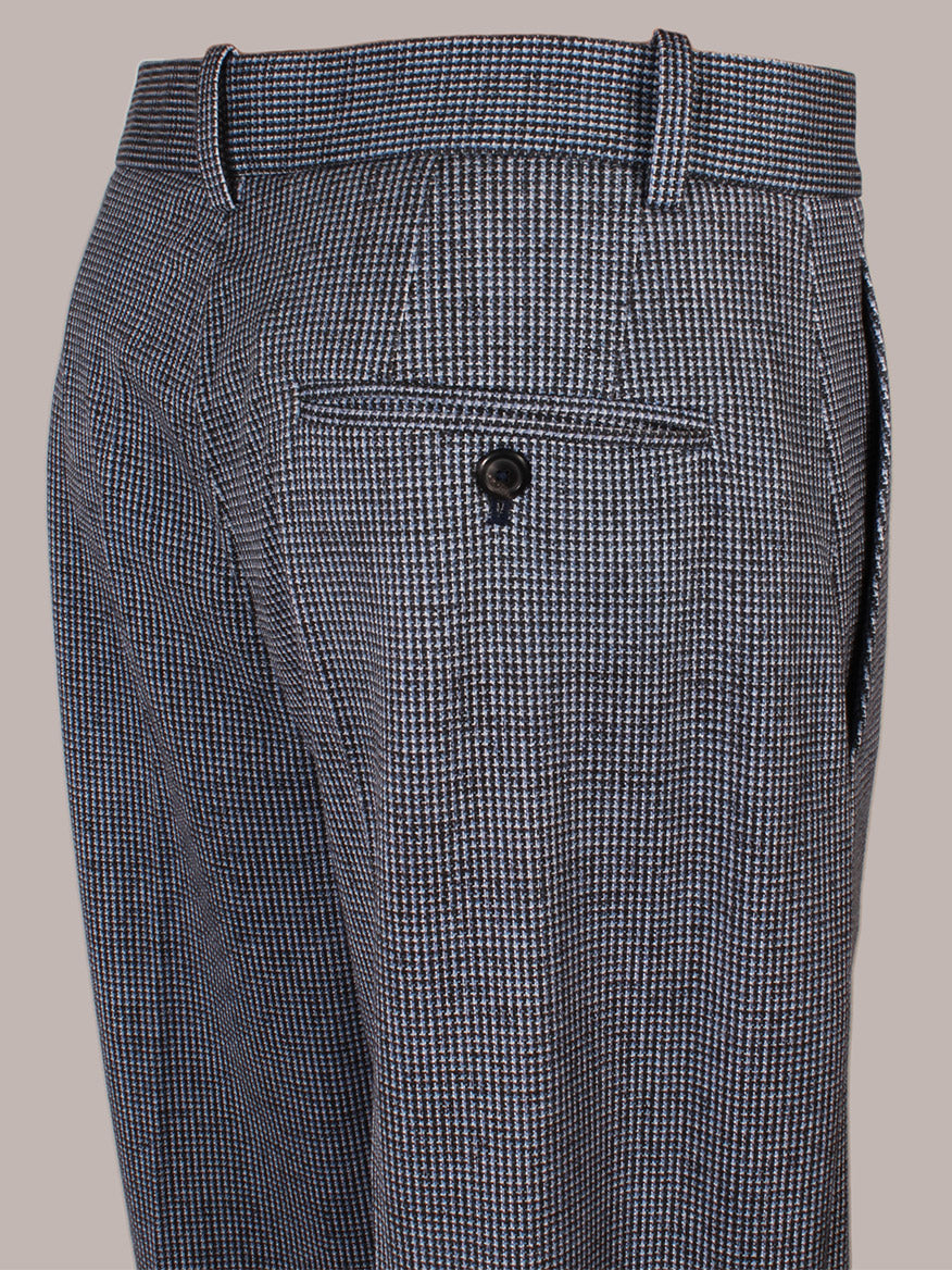 Close-up of the Circolo 1901 Mini Houndstooth Trouser in Blue, highlighting the single buttoned back pocket, belt loops, side seam detail, and a smart tab and bar waist closure.