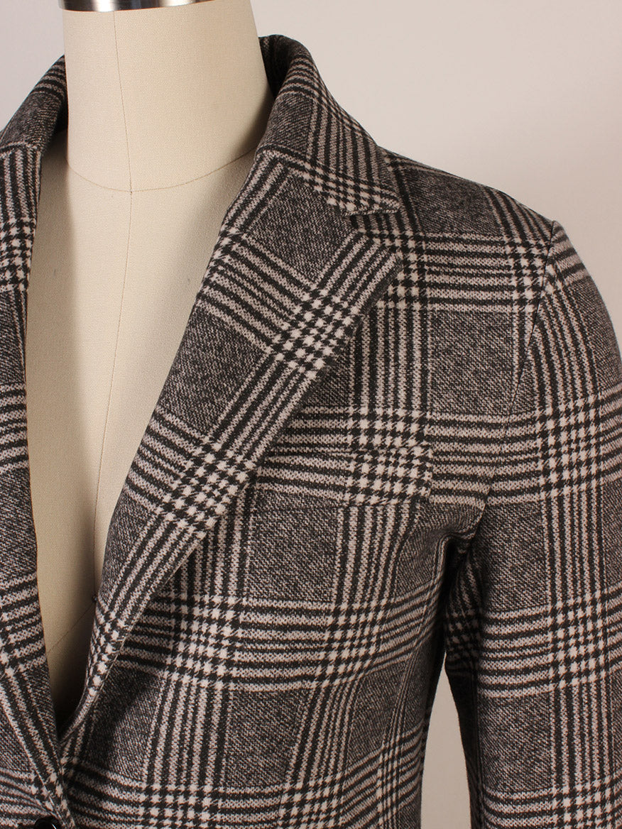 Close-up of the Circolo 1901 Overcheck Jacket in Black/Cream on a dress form, showcasing its notch lapels, collar, and part of the sleeve.
