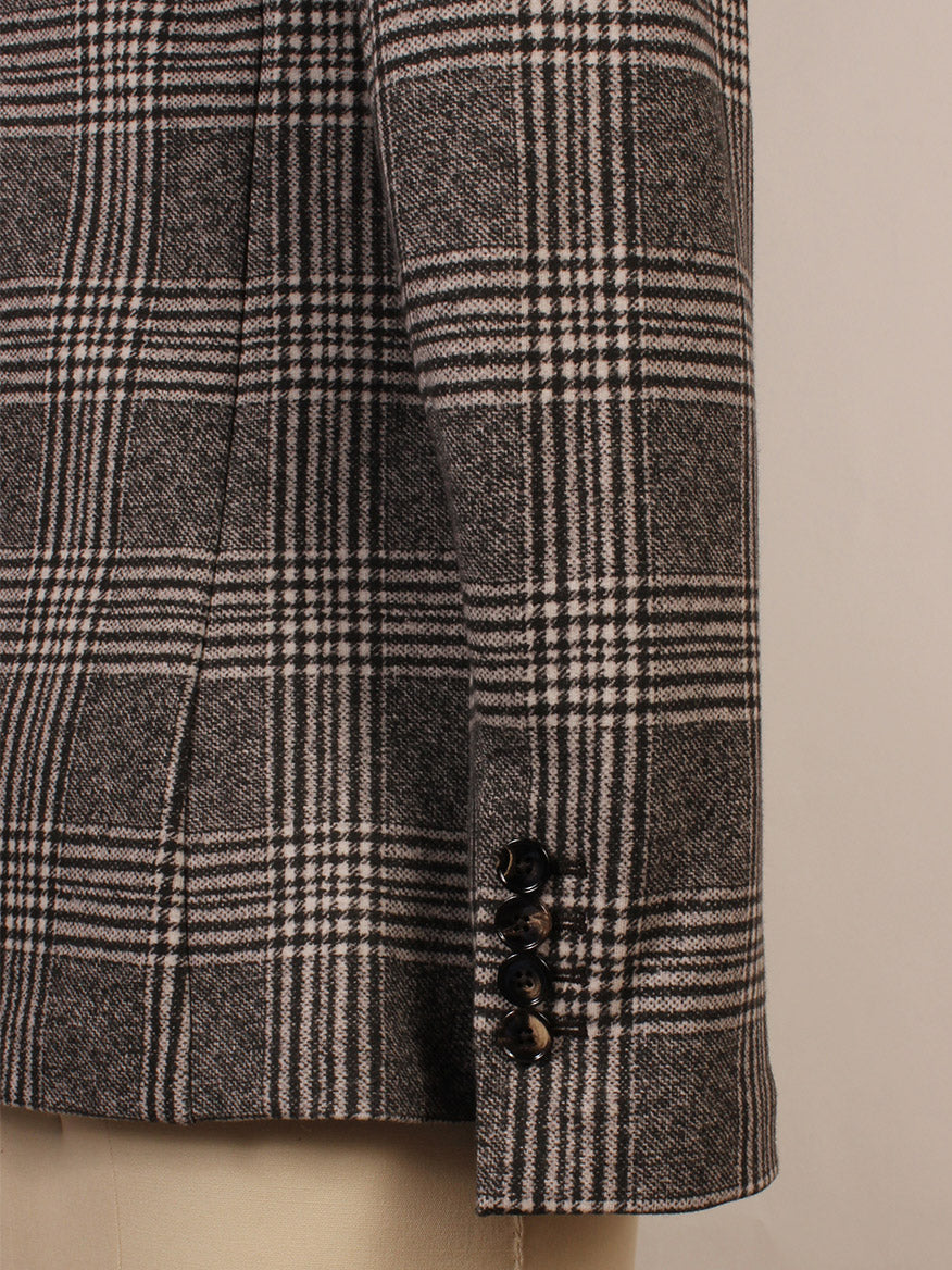 Close-up of the Circolo 1901 Overcheck Jacket in Black/Cream, highlighting its intersecting plaid pattern, three black cuff buttons, notch lapels, and refined front slip pockets for a polished look.