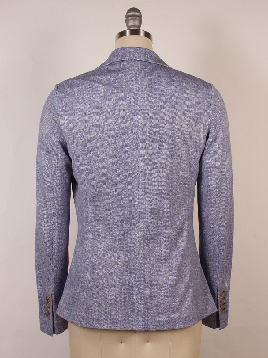 The Circolo 1901 2-Button Slim Herringbone Jacket in Dark Sky, shown from the back on a dress form, features long sleeves, brown cuff buttons, and classic notch lapels.