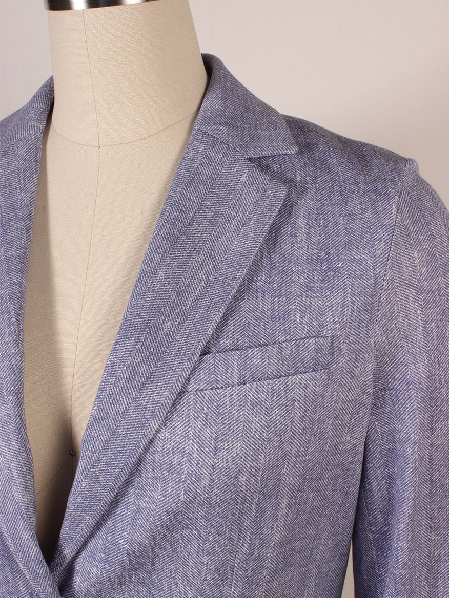 Close-up of the Circolo 1901 2-Button Slim Herringbone Jacket in Dark Sky on a dress form, featuring notch lapels, chest pocket, and upper sleeve details.