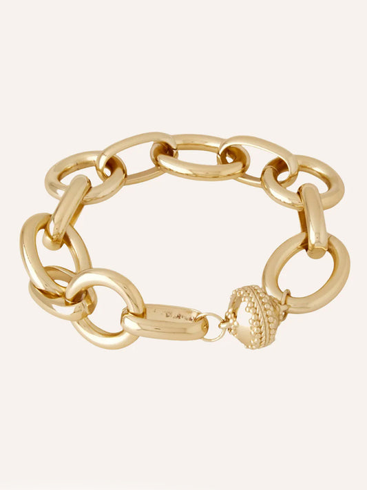 The Clara Williams Gold Coast Bracelet is a 14K yellow gold chunky chain with oval links and a crown-shaped decorative clasp.