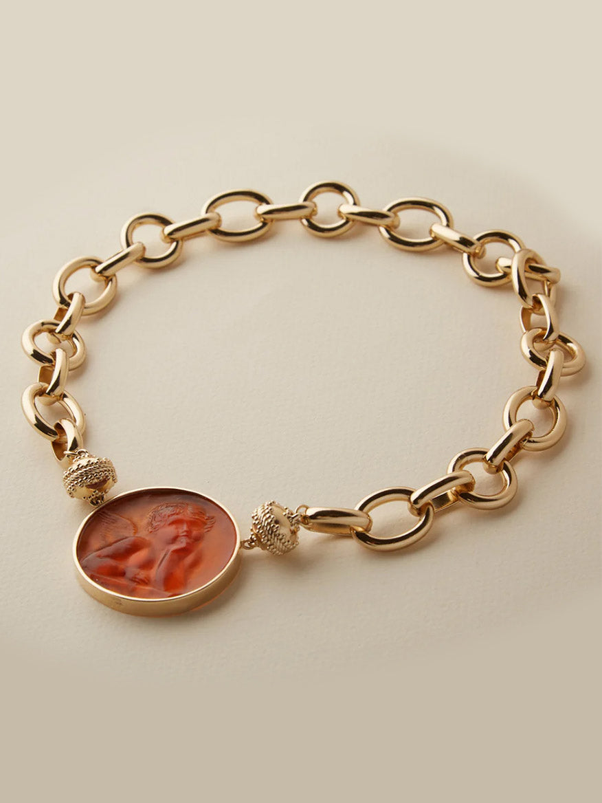 Gold chain bracelet with a sculpted profile cameo pendant, displayed on a neutral background—pairs beautifully with the Clara Williams Gold Coast Necklace for an elegant layered look.