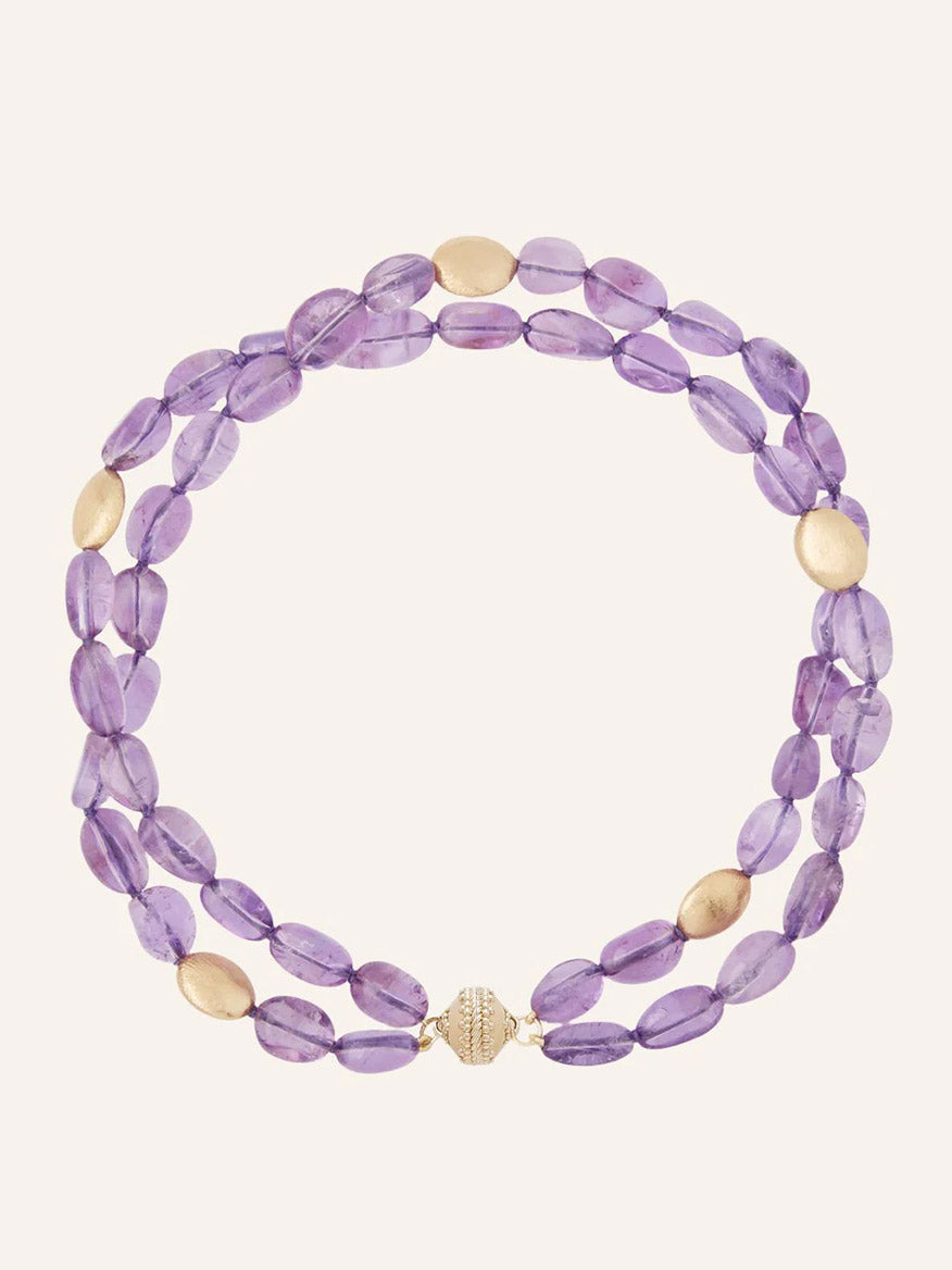 Clara Williams Gold Rush Amethyst Double-Strand Necklace with oval purple amethyst beads and round 14K yellow gold beads, finished with a gold clasp, displayed on a plain background in the brand's signature style.