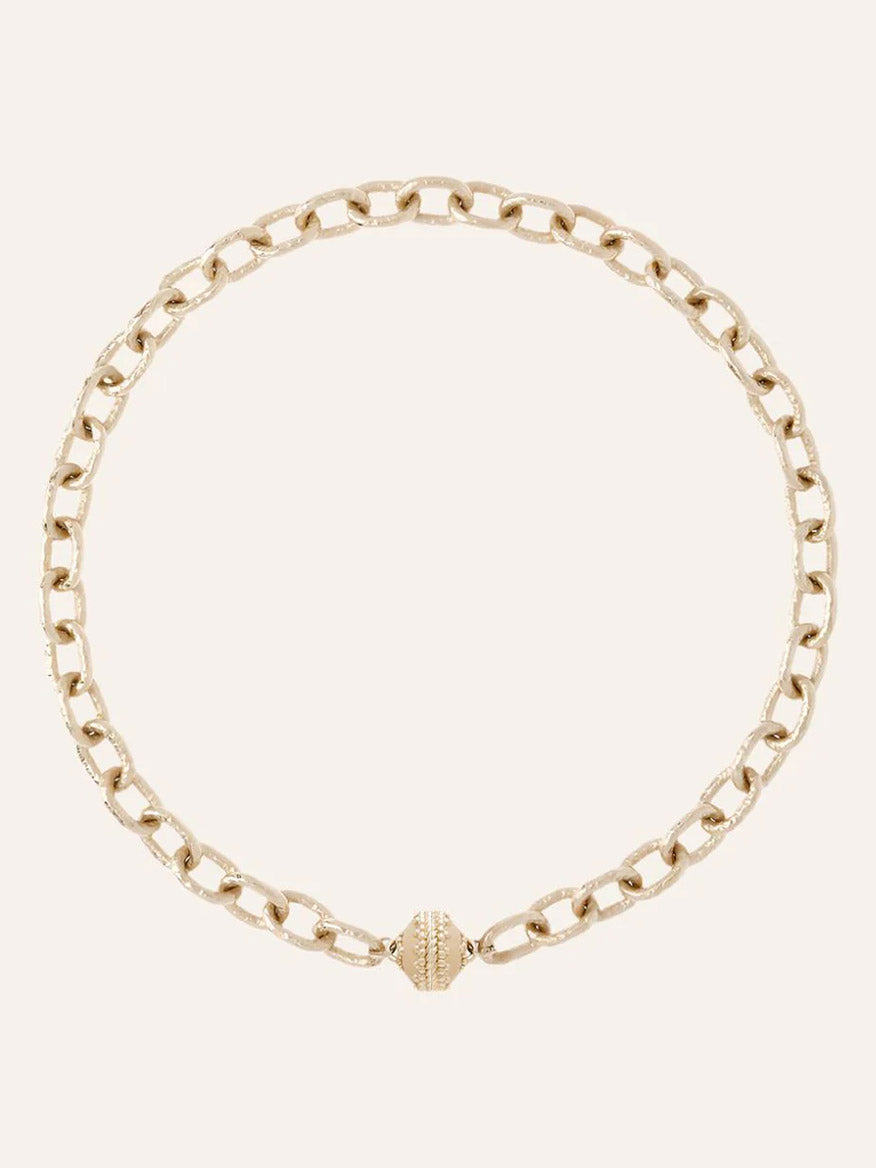 The Clara Williams Wabash Necklace, crafted in 14K yellow gold with hammered oval links and a textured ClaraClasp at the front, is displayed against a plain light background.