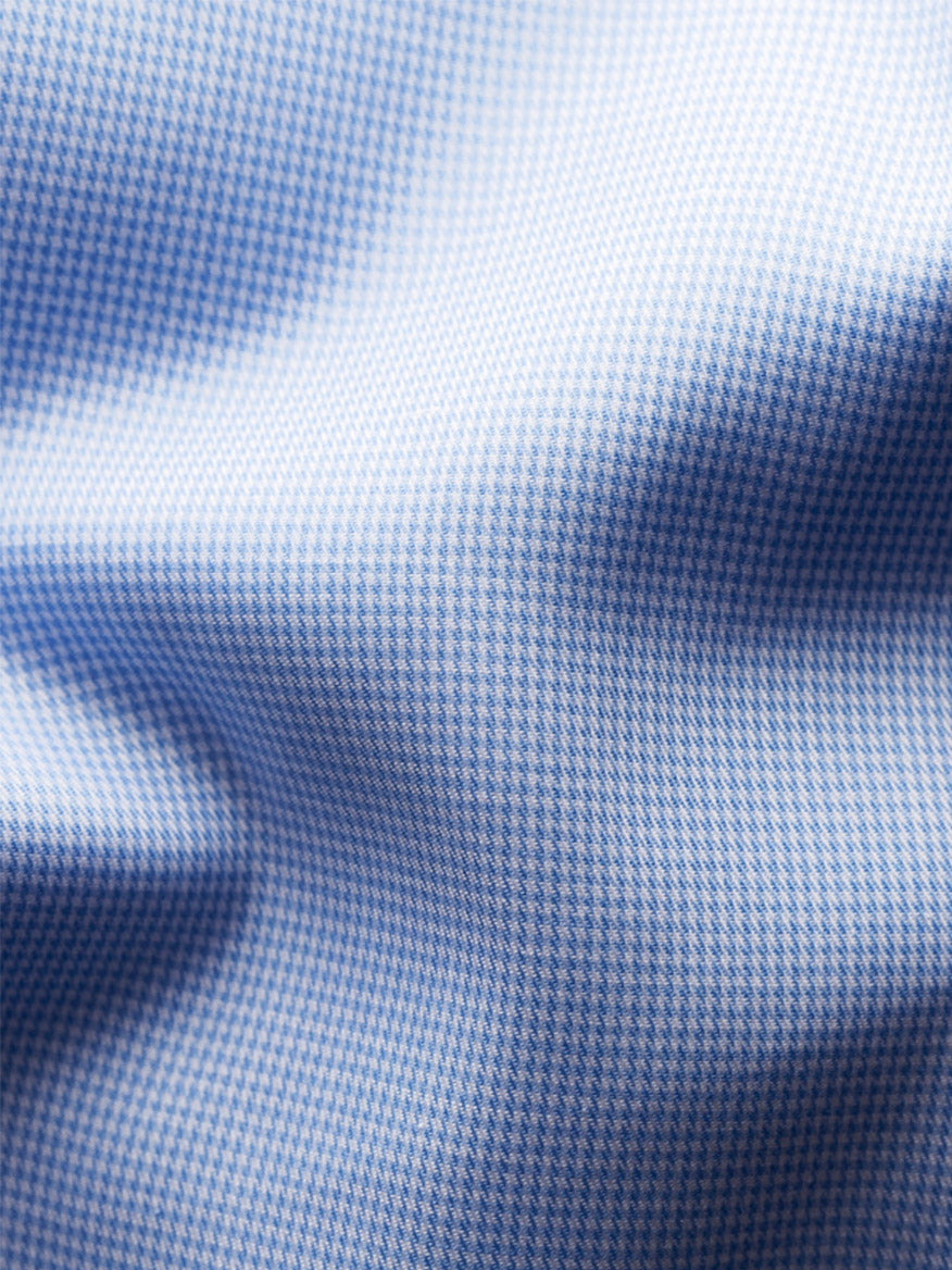 Close-up of the Eton Slim Fit Houndstooth Fine Twill Dress Shirt in Light Blue, highlighting its checked organic cotton fabric, visible folds, and soft texture.