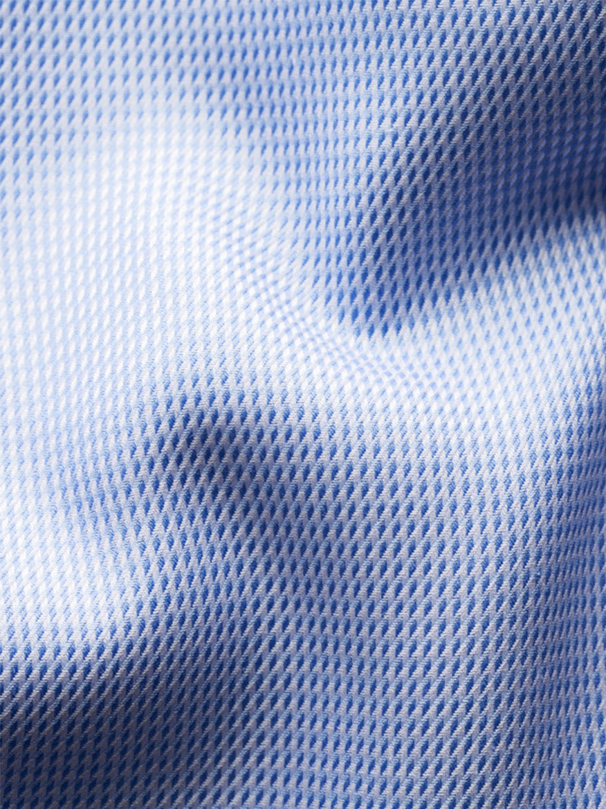 Close-up of the Eton Contemporary Fit Semi Solid Dobby Dress Shirt in Light Blue, featuring a grid-like textured pattern and slight folds.