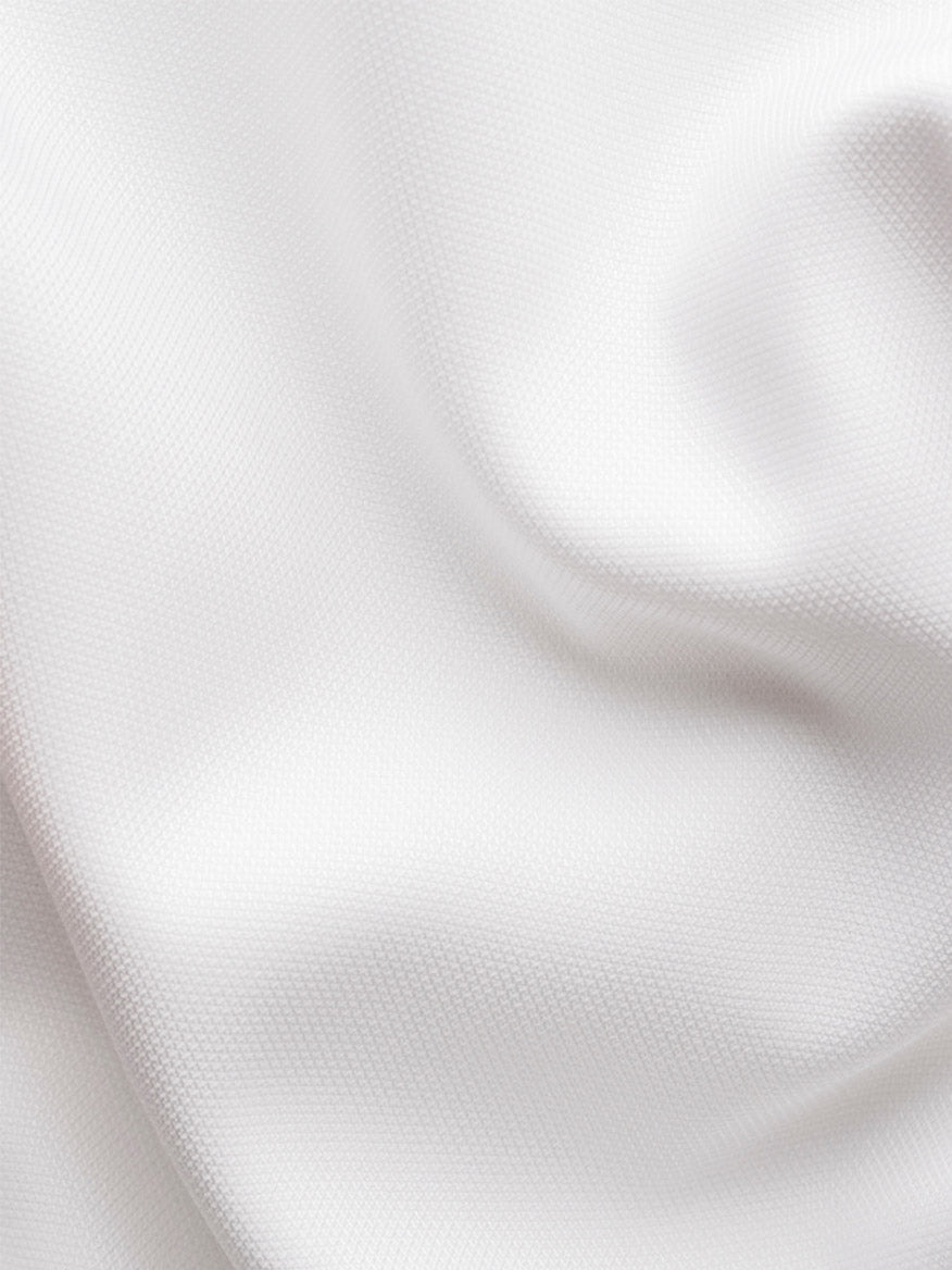 Close-up of the Eton Slim Fit Semi Solid Dress Shirt in White, featuring a textured fabric with soft folds and a subtle weave pattern—perfect for a refined, modern look.