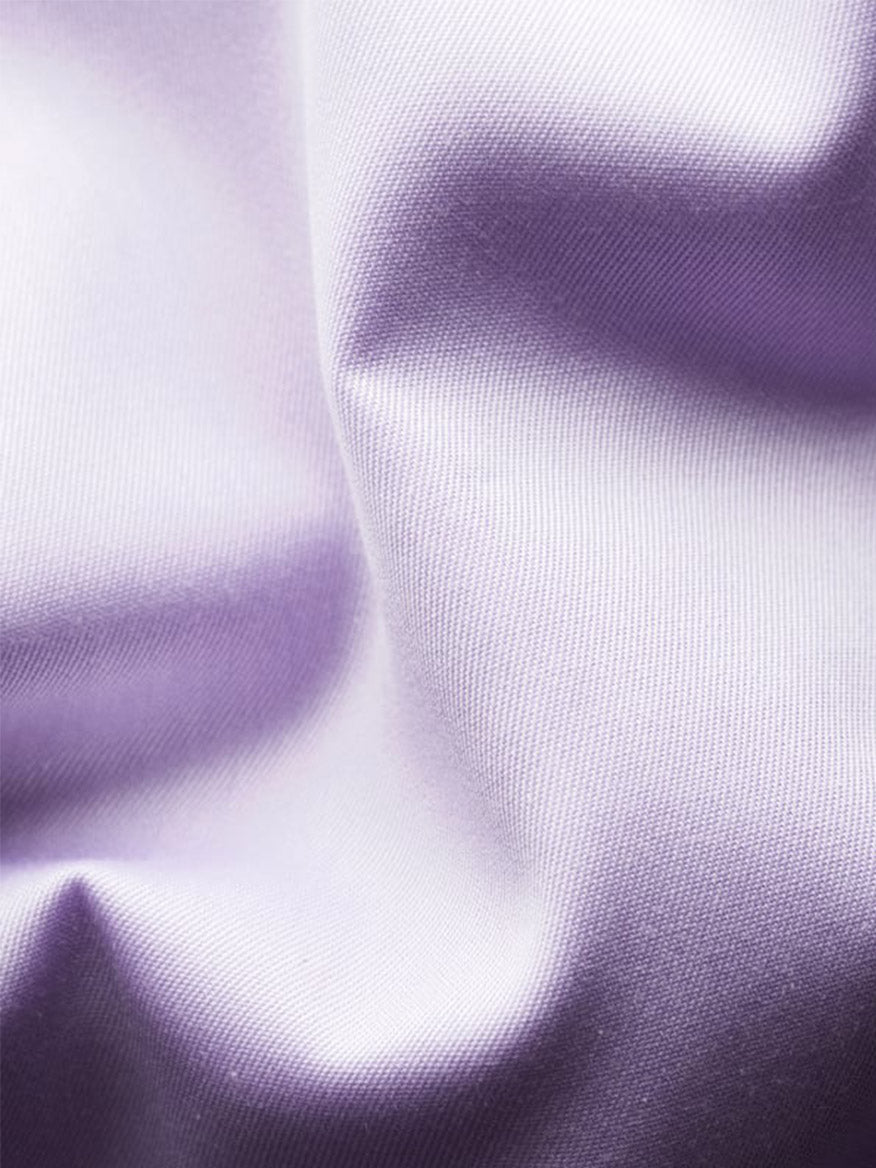 Close-up of smooth, mid purple fabric with soft folds—perfect inspiration for the Eton Slim Fit Solid Signature Twill Dress Shirt in Mid Purple, ideal for an elegant, wrinkle-free business look.
