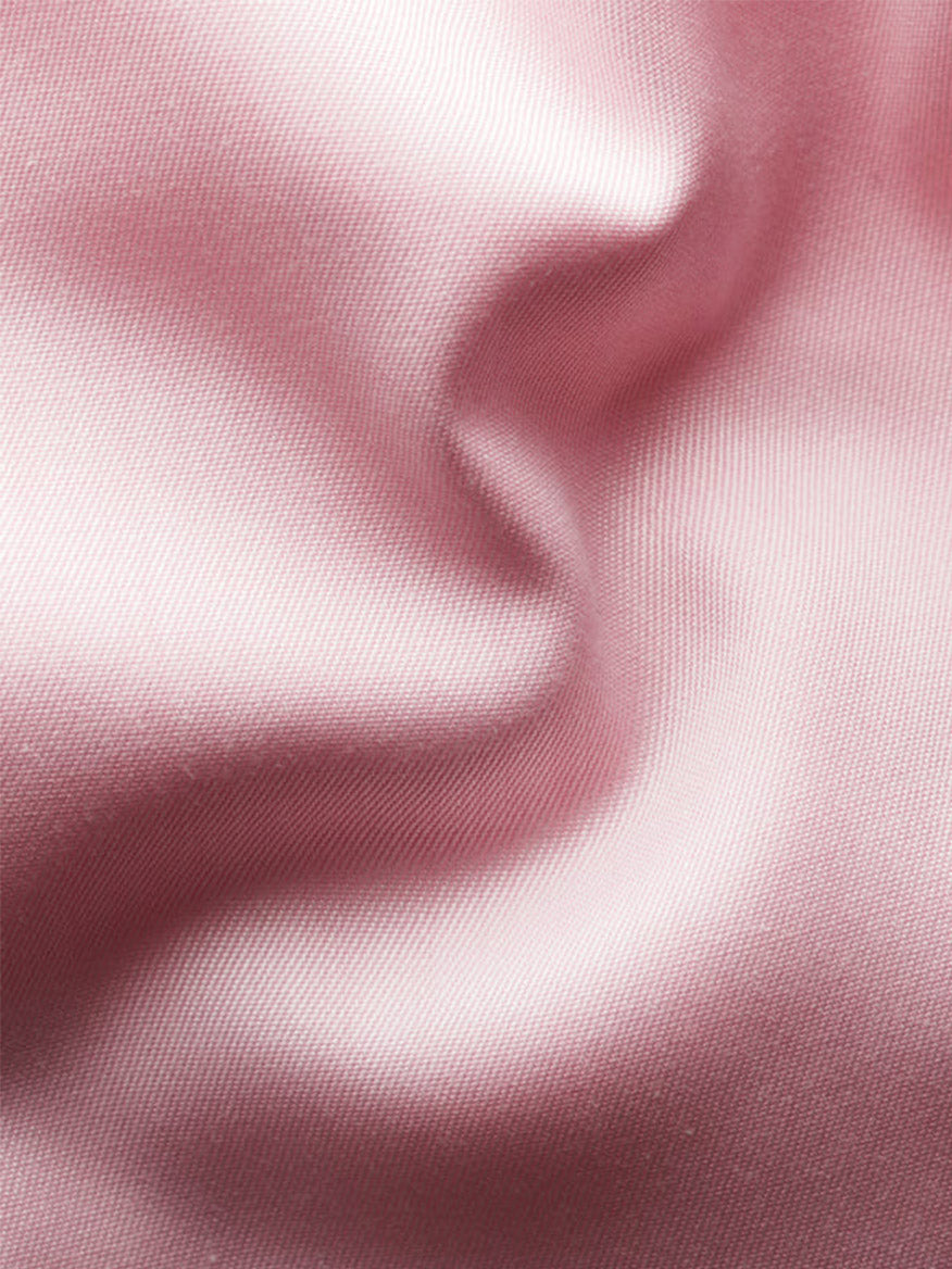 Close-up of the Eton Slim Fit Solid Signature Twill Dress Shirt in Pink, showcasing the soft folds and smooth texture of its refined signature twill fabric.