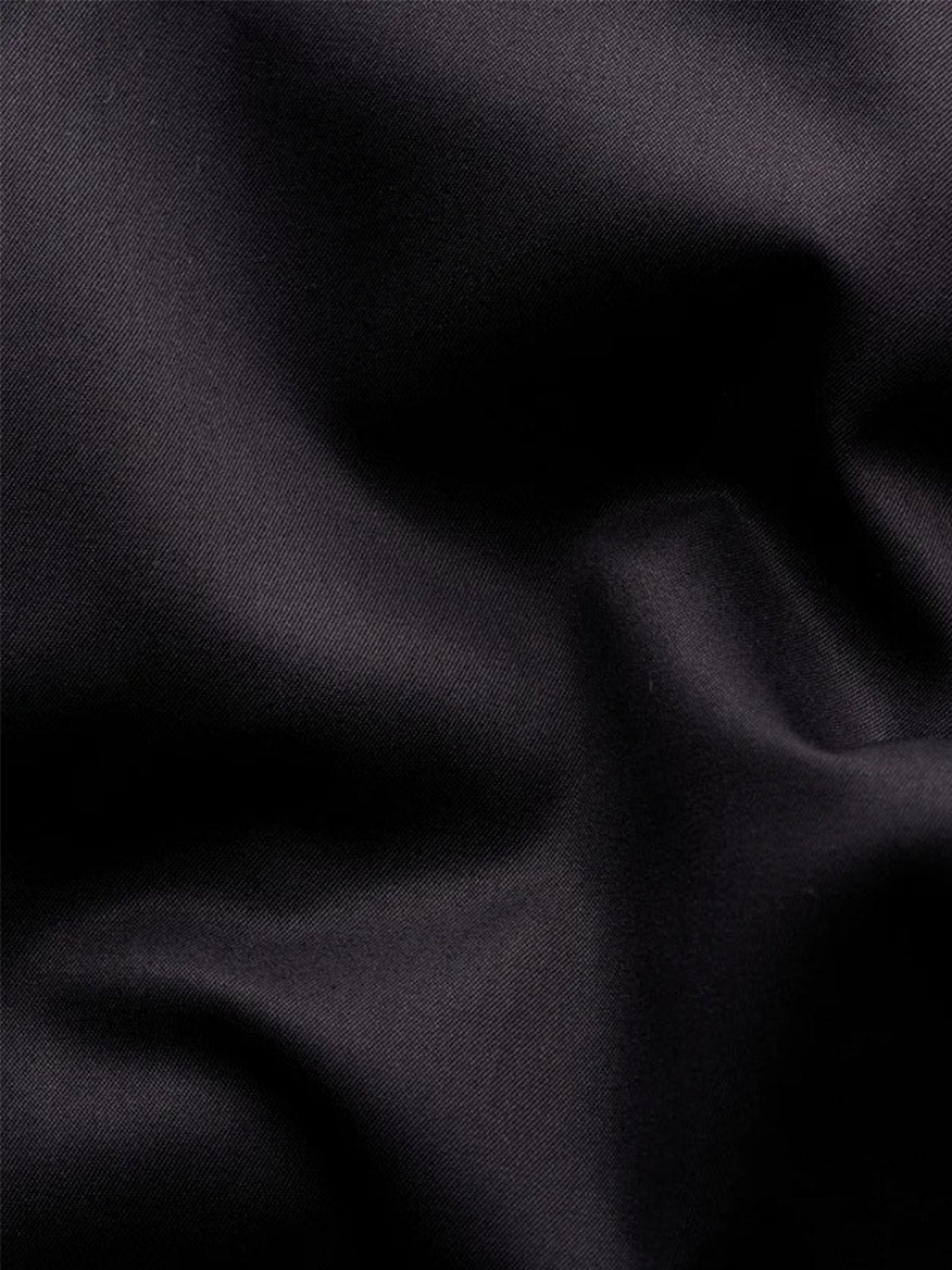 Close-up of soft folds in black elevated twill fabric of an Eton Slim Fit Solid Elevated Twill Dress Shirt.