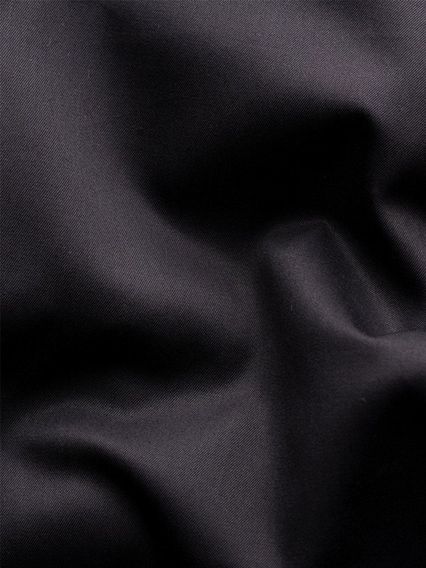 Close-up of the Eton Slim Fit Solid Elevated Twill Dress Shirt in Black, highlighting smooth, slightly glossy fabric with visible folds—perfect for a luxury or crease-resistant dress shirt.