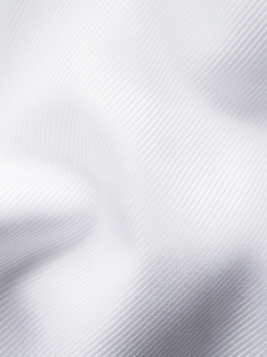 Close-up of Eton Slim Fit Solid Textured Twill Dress Shirt in White with fine diagonal lines and French cuffs, ideal for a sharp, modern look.