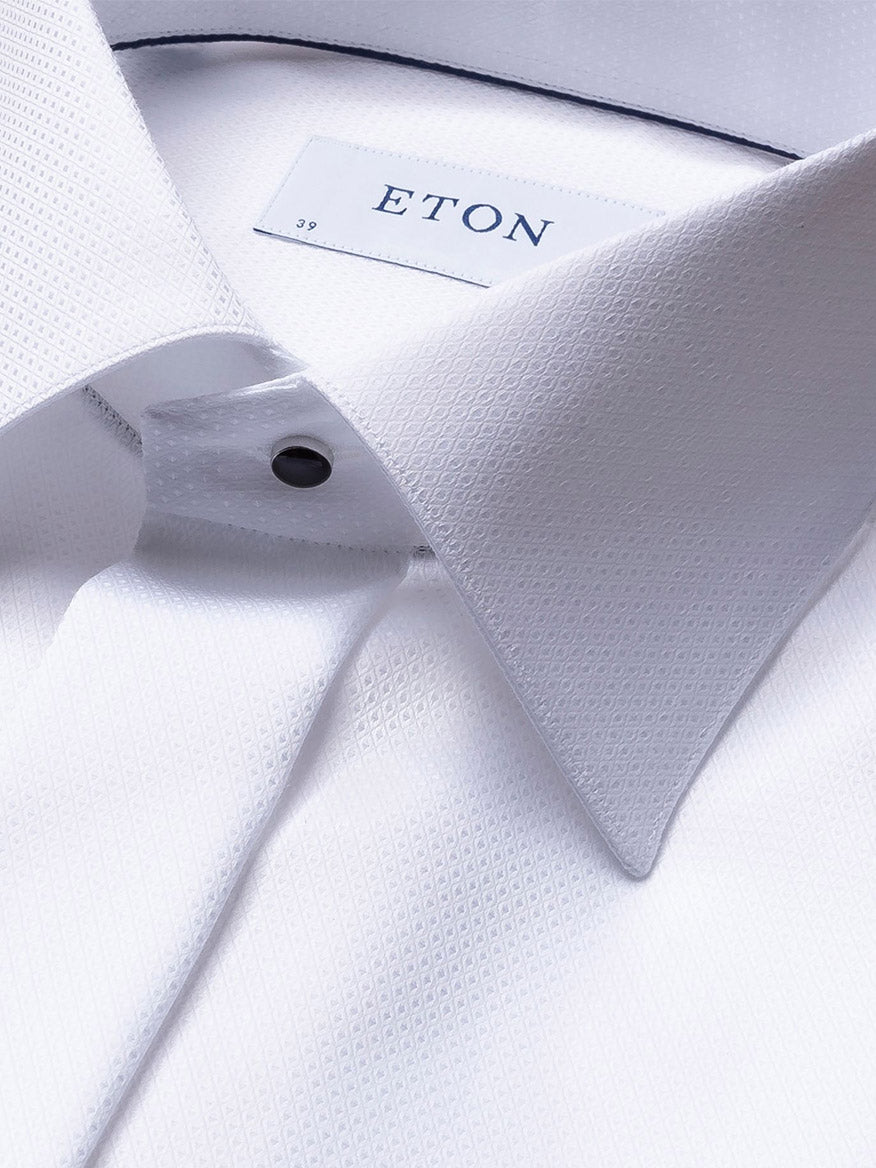 Close-up of an Eton White Dobby Formal Shirt crafted from dobby fabric, featuring a textured pattern. The label displays the brand name "Eton" and size "39", making it an ideal elegant evening shirt for black tie events.