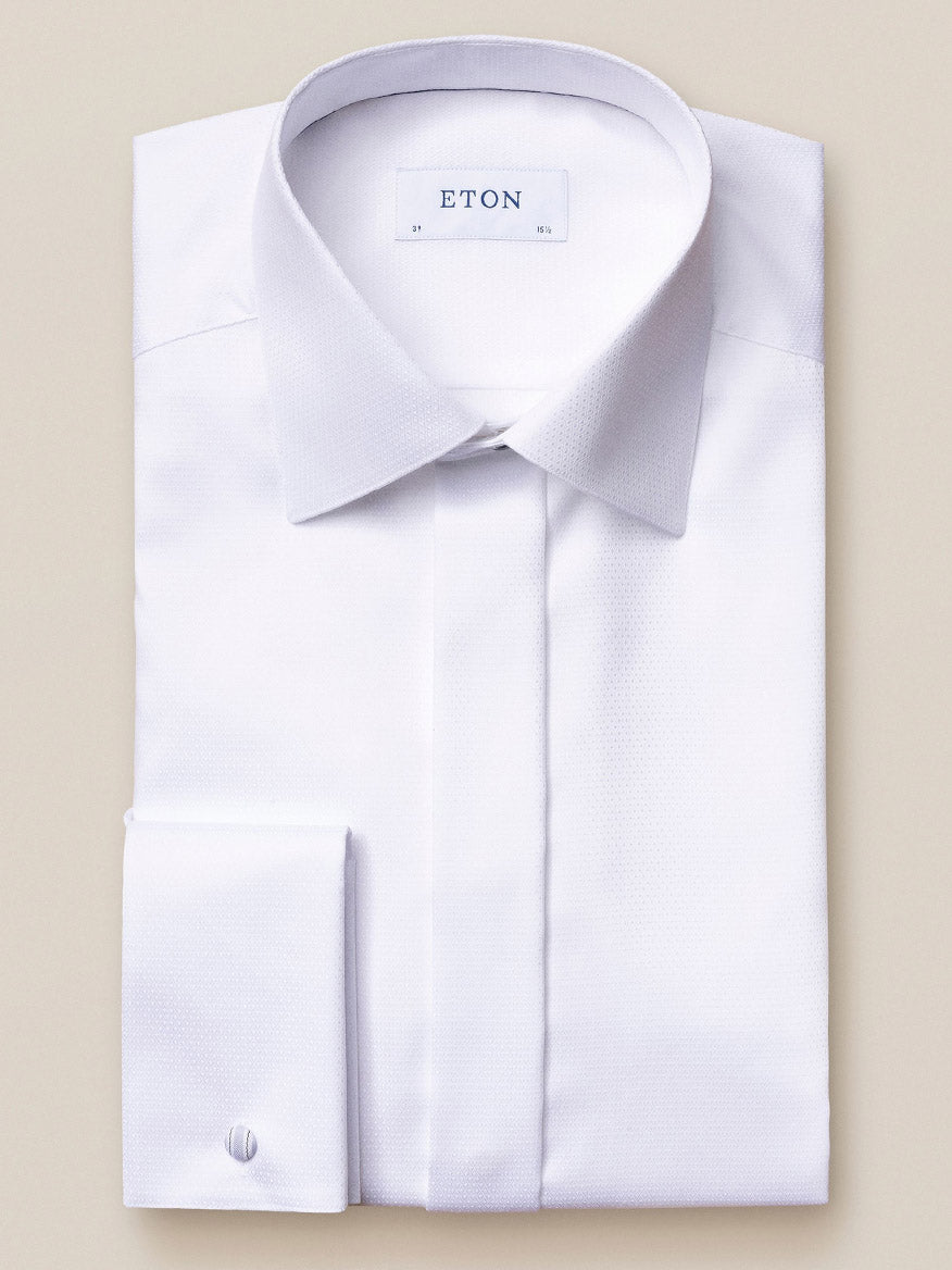 Folded Eton White Dobby Formal Shirt with a pointed collar and French cuffs, made from luxurious dobby fabric and labeled "Eton" on the inner collar.
