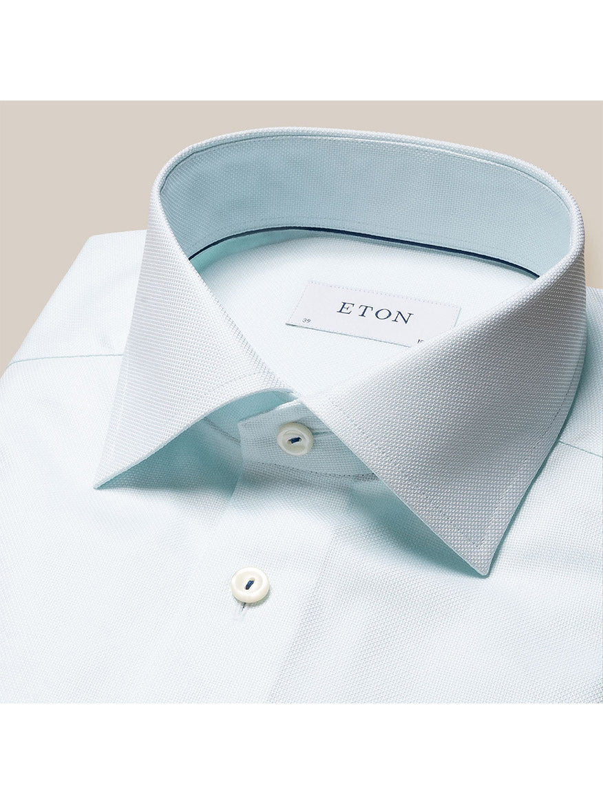 Close-up of a Eton Green Dobby Dress Shirt focusing on the cutaway collar and top button, displayed on a neutral background.
