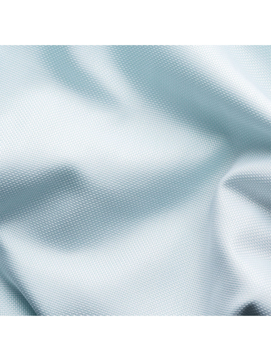 Close-up of a textured Eton Green Dobby Dress Shirt fabric with soft, flowing wrinkles.