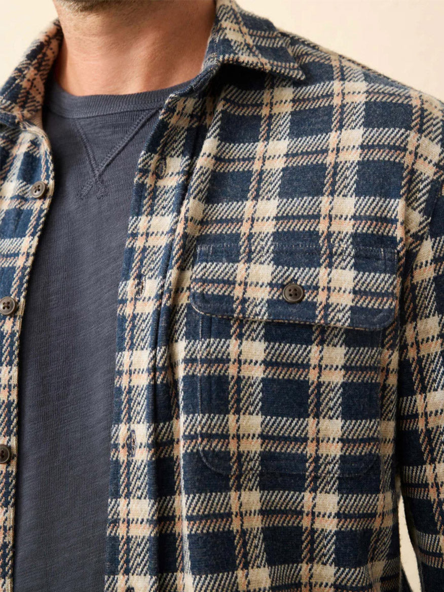 A close-up of the Faherty Brand Legend Sweater Shirt in Golden Lake Plaid, highlighting its custom fabric blend and refined details.