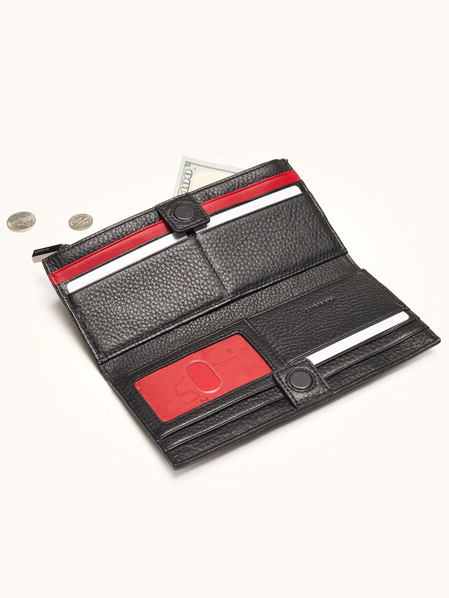 The Hammitt Los Angeles 110 North Wallet in Evening Crocco is an open black crocco-embossed leather wallet with red accents, displayed on a light background with two coins beside it, designed to hold cards and cash.
