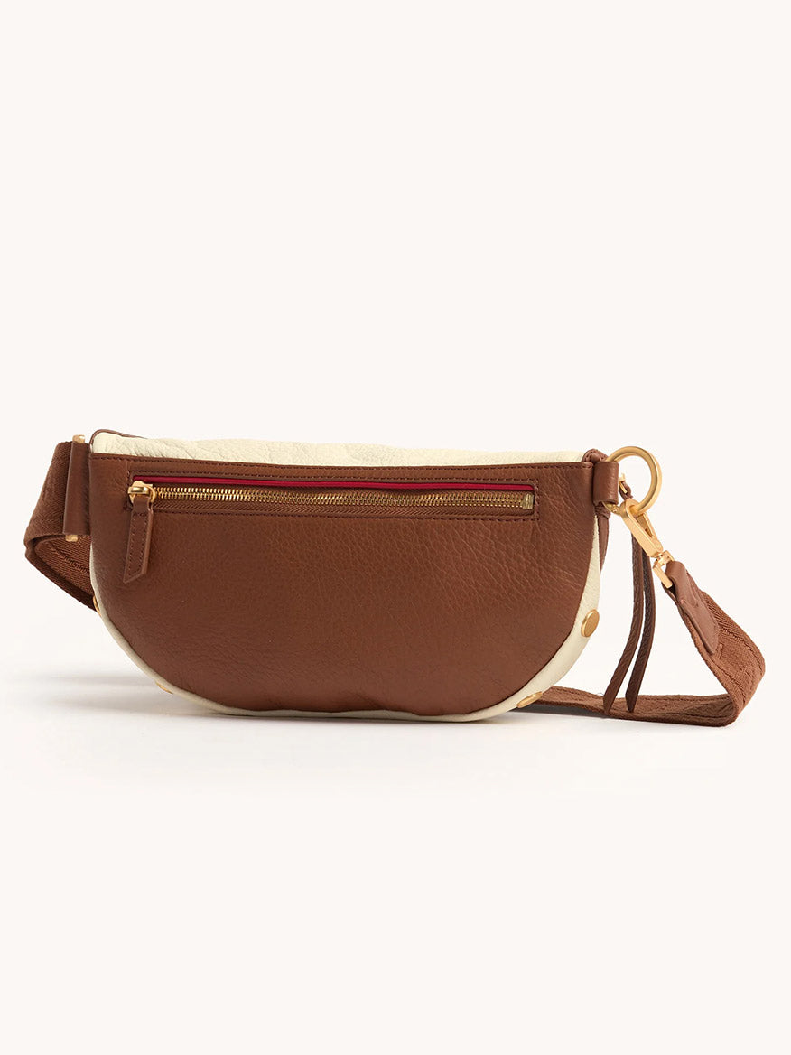 Hammitt Los Angeles Charles Crossbody Medium in Courtyard Cream, featuring pebbled brown and beige leather, front zipper pocket, adjustable strap, and gold-tone hardware, shown against a plain white background.