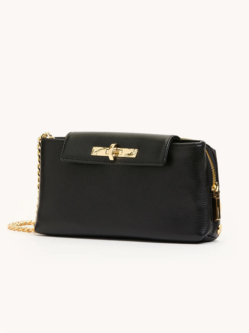 The Hammitt Los Angeles Charlotte Small in Black/Gold is a pebble leather wallet-on-chain crossbody bag featuring a gold chain strap and gold hardware on the clasp and zipper, shown against a plain light background.