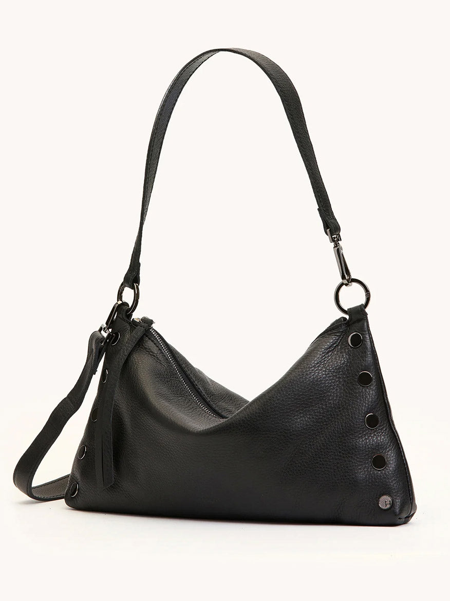 The Hammitt Los Angeles Kyle Medium Shoulder Bag in Black/Gunmetal features black pebble leather, a single shoulder strap, side grommet accents, a zippered main compartment, and a small metal Kyle Med logo on one corner.
