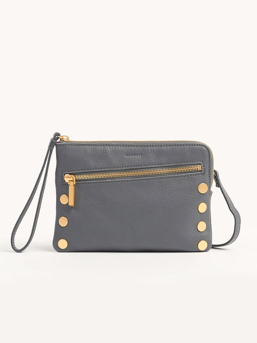 The Hammitt Los Angeles Nash Small Clutch in Sonnet Grey/Brushed Gold features pebbled leather, gold button accents, a front zipper pocket, and a detachable strap. Wear it as a wristlet or convert it into a crossbody bag for versatile style.