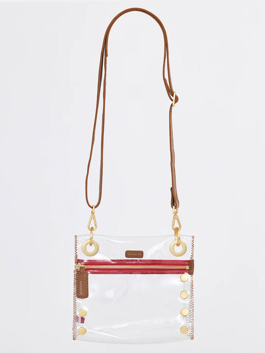The Hammitt Los Angeles Tony Small Crossbody Bag in Clear Mahogany Pebble & Red Zip features a stadium-approved clear design, brown leather trim, gold hardware, red zip pocket, and an adjustable crossbody strap for versatile style.