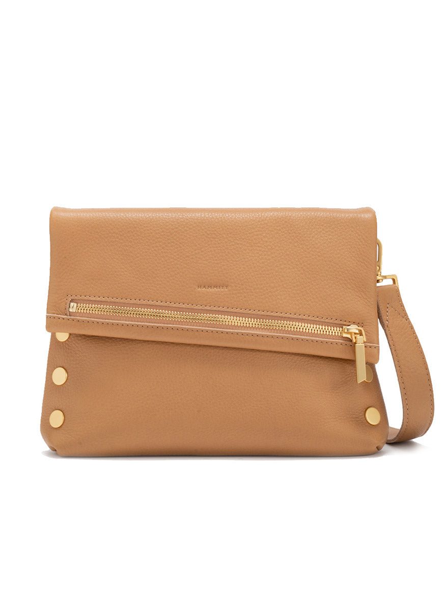 The Hammitt Los Angeles VIP Medium Clutch in Toast Tan/Brushed Gold features pebbled leather, fold-over flap, gold zipper, four gold side rivets, detachable wrist strap, and an optional crossbody strap for versatile styling.