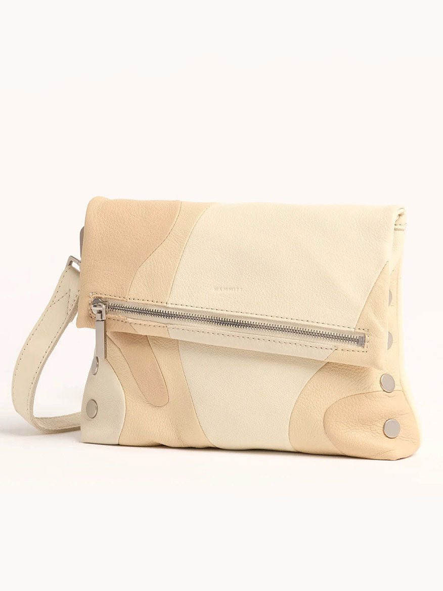The Hammitt Los Angeles VIP Medium Clutch in Coastal Cream/Brushed Silver features an abstract pattern, front zipper pocket, brushed silver studs, and a wrist strap.