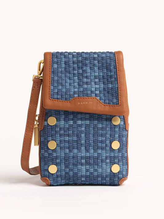 The Hammitt Los Angeles VIP Mobile in Mosaic Denim/Brushed Gold is a small rectangular crossbody bag with woven blue fabric, brown leather trim, gold accents, a wrist strap, and a convenient cellphone pocket.