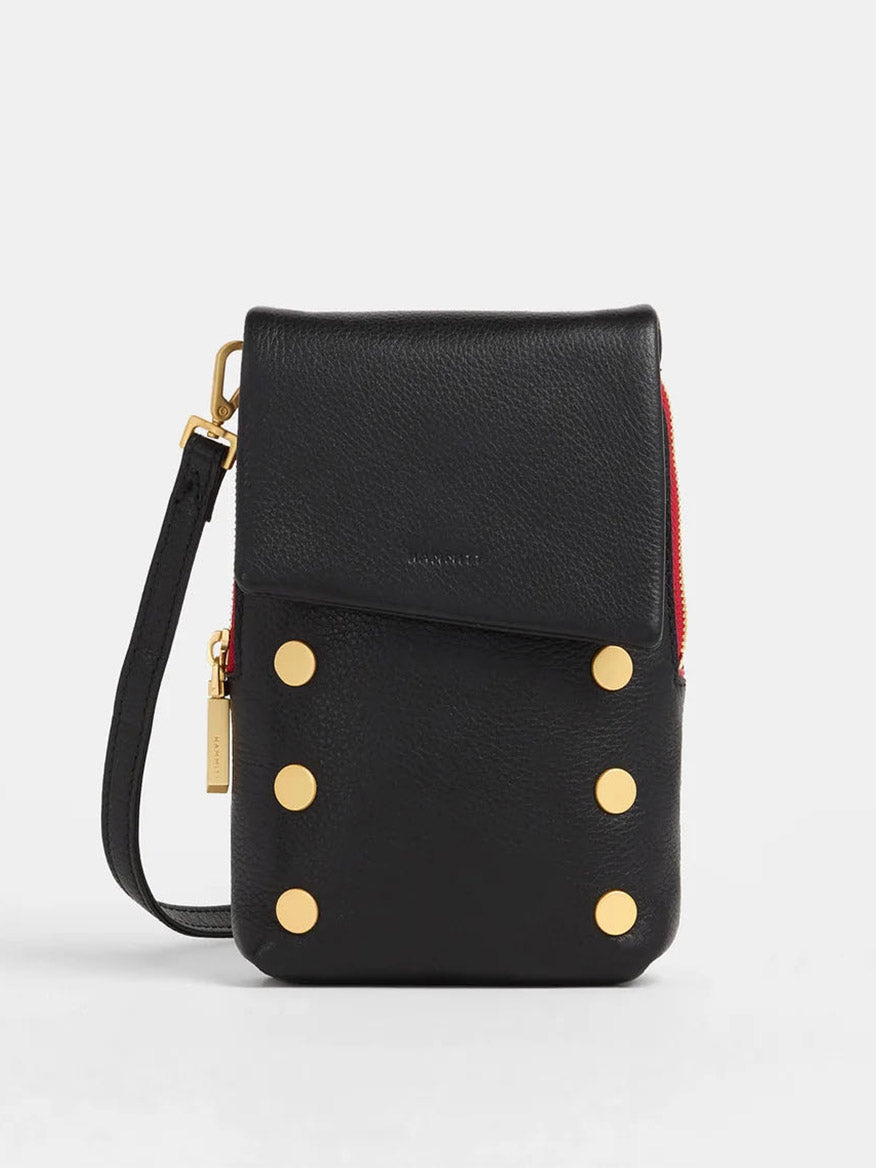 The Hammitt Los Angeles VIP Mobile in Black/Brushed Gold/Red Zip is a compact crossbody with gold accents, a bold red side zipper, and a detachable strap—perfect for carrying your essentials in style.