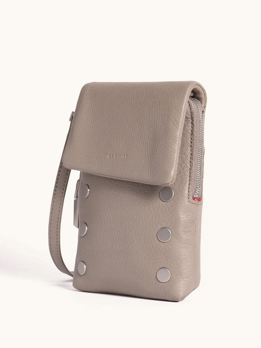 The Hammitt Los Angeles VIP Mobile in Pewter/Brushed Silver, a compact pebbled leather bag with a flap closure, silver studs, side zipper, wrist strap, and cellphone pocket, is displayed against a plain light background.