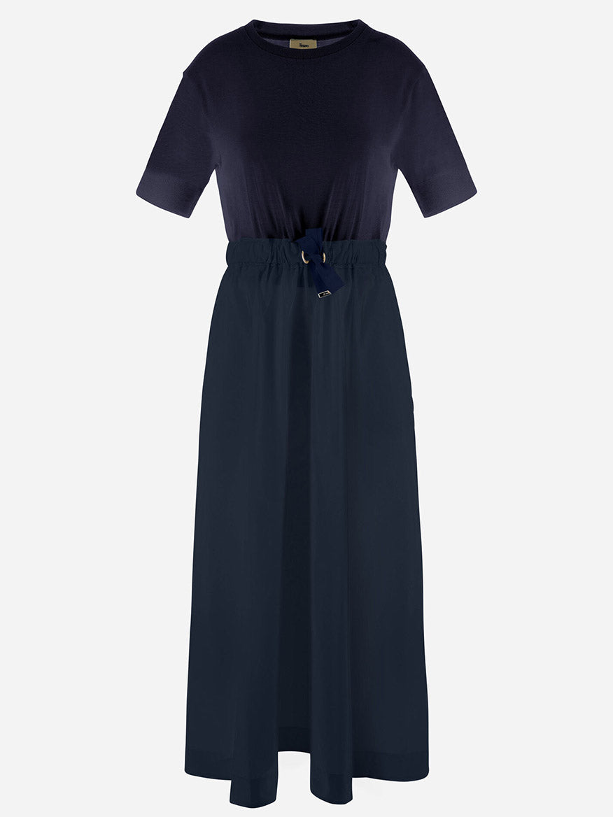 The Herno Glam Knit Effect Dress in Techno Taffeta in Navy features a straight silhouette, minimalist design, cinched waist with drawstring tie, all crafted in sleek techno taffeta for a modern look.