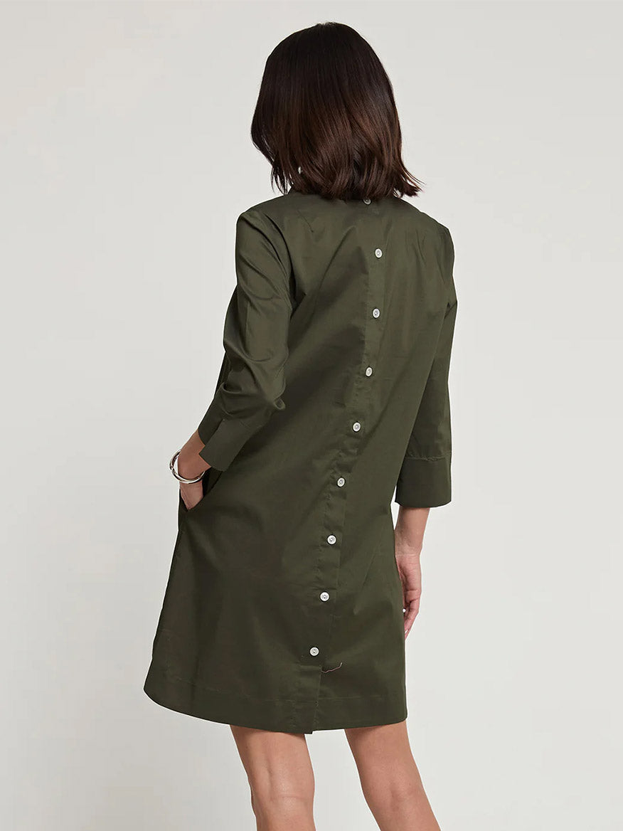 A woman is wearing the Hinson Wu Aileen 3/4 Sleeve Button Back Dress in Oregano, a knee-length polished cotton piece featuring button details down the back.