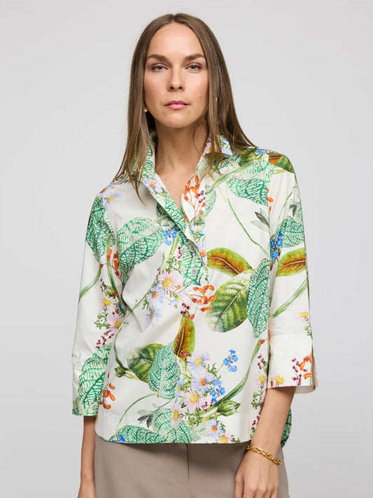 A person in a Hinson Wu Aileen 3/4 Sleeve Botanical Flora Print Shirt in Multi and beige pants stands against a plain background.