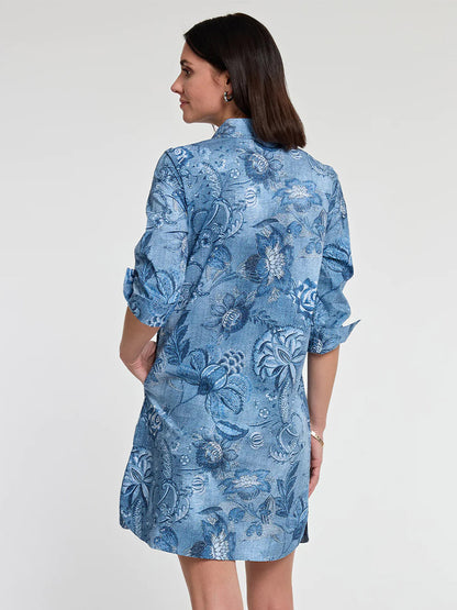 Woman posing sideways wearing a blue Hinson Wu Charlotte 3/4 Sleeve Passionflower Print dress in a popover style.