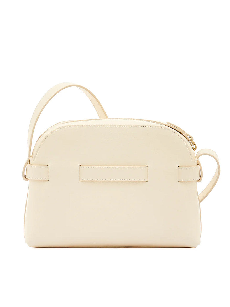 The Il Bisonte Elisa Crossbody in white cowhide leather is a minimalist Italian-made bag with a curved top, zipper closure, and slim adjustable strap, shown against a white background.