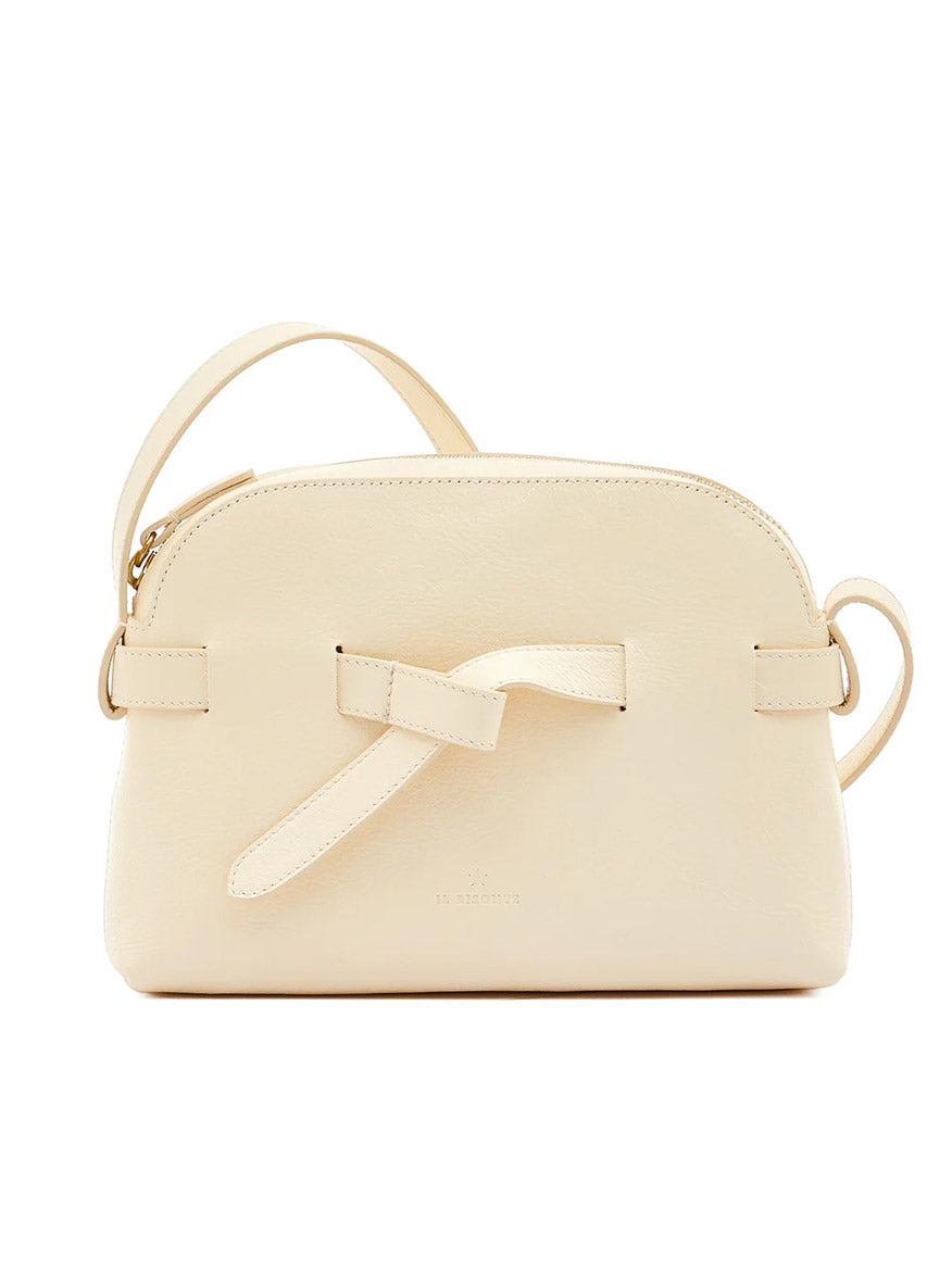 The Il Bisonte Elisa Crossbody in white cowhide leather features a minimalist design with a bow detail on the front and a single shoulder strap. Expertly crafted in Italy.