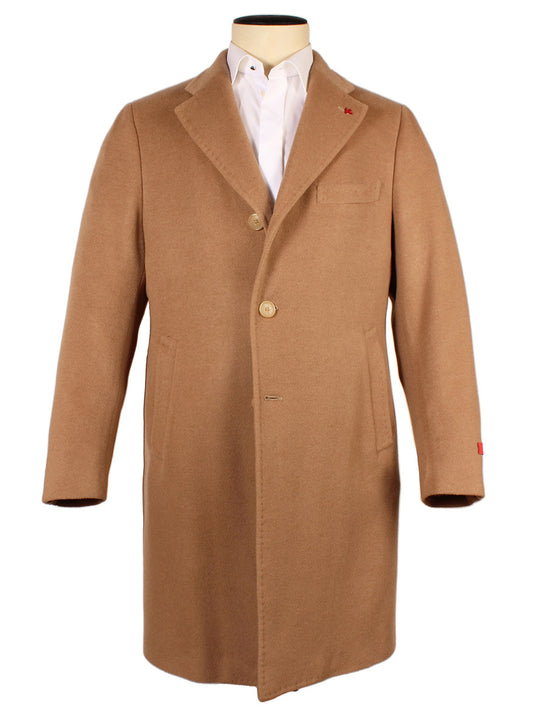 The Isaia Ross Baby Camel Topcoat, made in Italy, features a notched lapel, three-button closure, and two front pockets. Displayed on a mannequin with a white dress shirt.