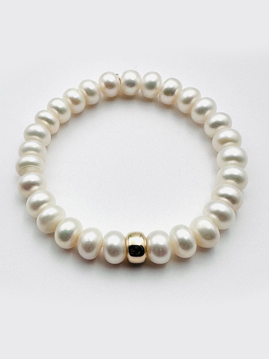 The JMNYC Designs Freshwater Button Pearl Bracelet With Gold Fill Rondelle is shown on a plain white background.